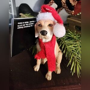 Festive Dog Figurine with Red Santa Hat and Scarf
